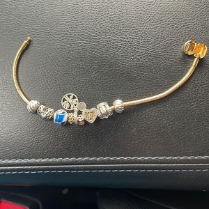 Pandora gold moments bracelet with charms